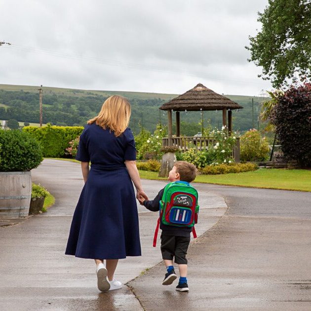 A mum and a child walking together after mum trained to become a sleep consultant